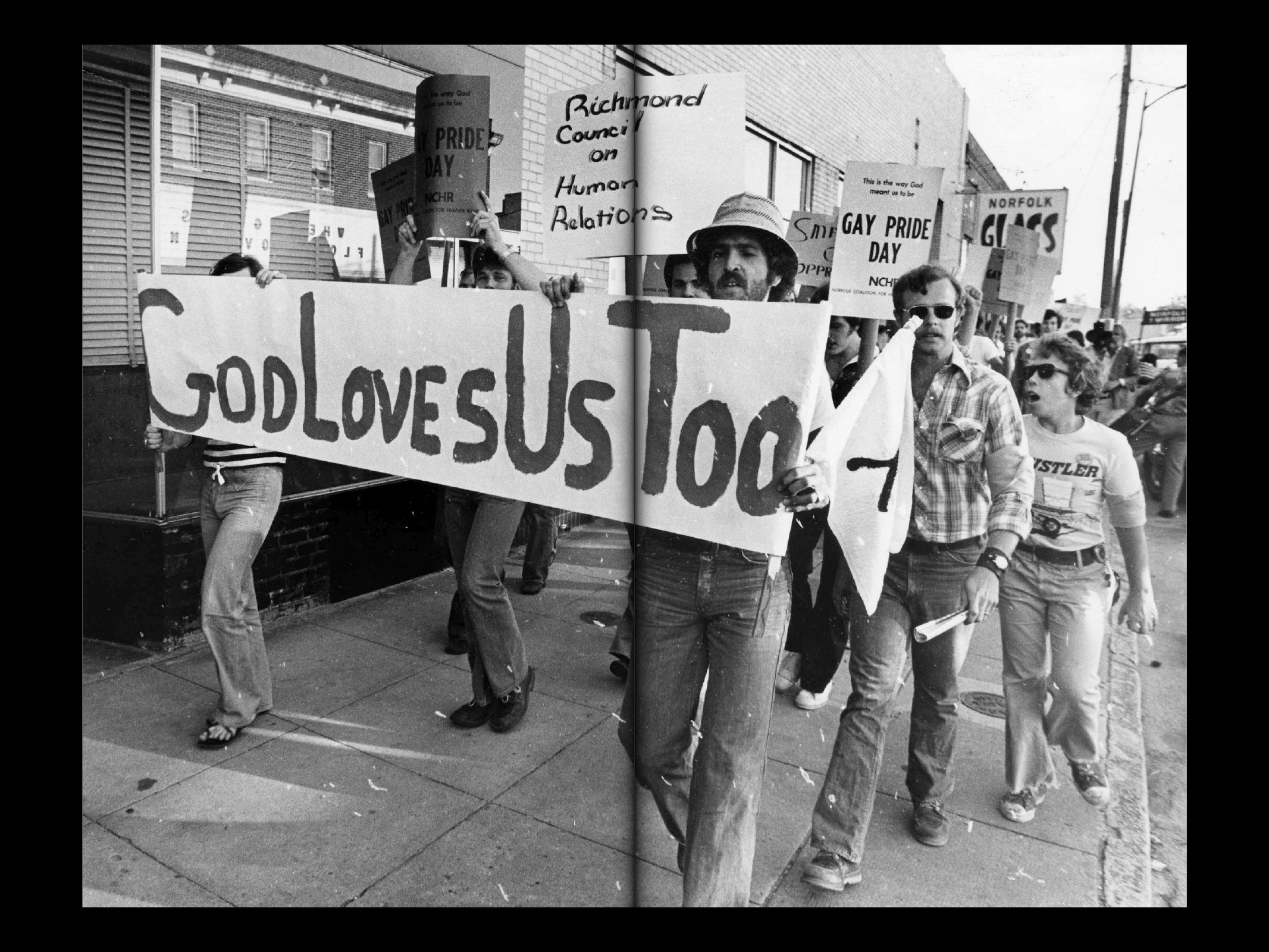 Graphic of a typography specimen showing the alphabet and numerals on top of a dark gray background.
