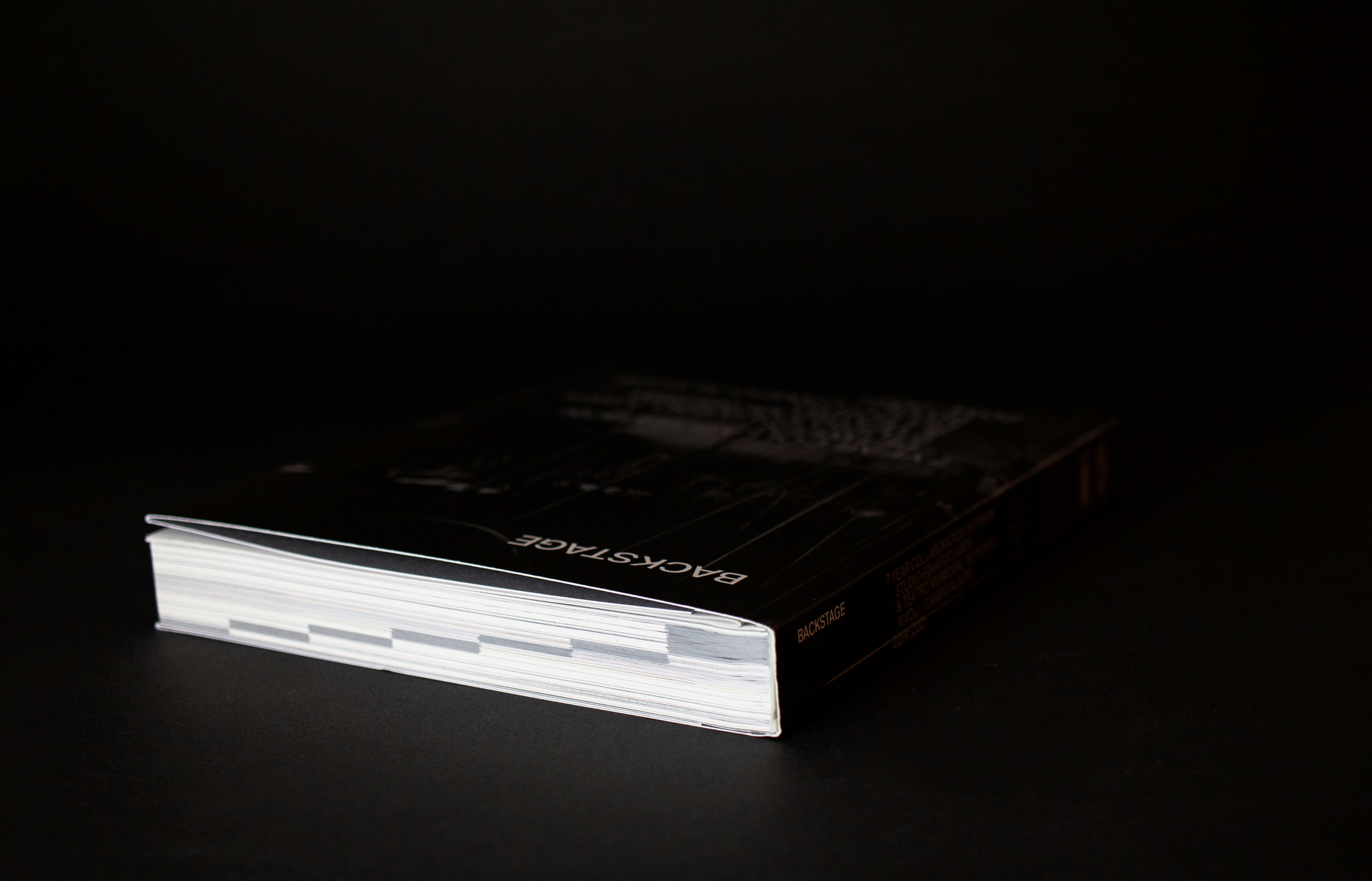 Stationery design of letterhead and business cards for the company Anders on top of a blurred photo of a house interior.